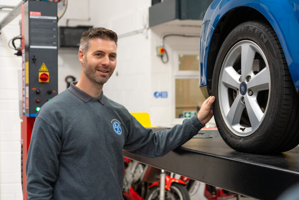 Director of MOT Compliance South East (former DVSA Vehicle Examiner), Leon checking a tyre